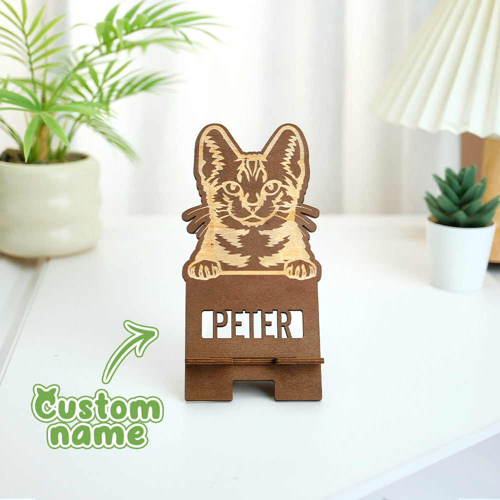 Wooden phone stand displaying engraved pet portrait