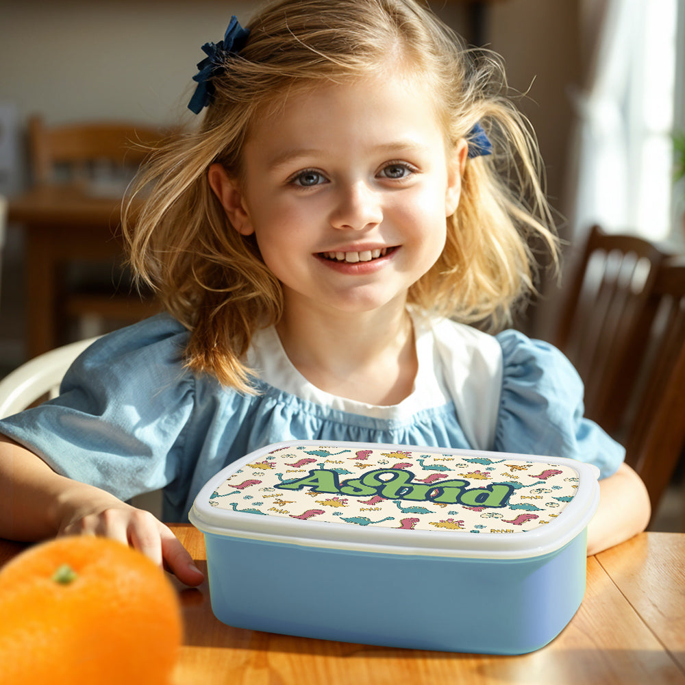 Front view of dinosaur print lunch box showing bright cartoon artwork – personalised kids gift for birthdays and school