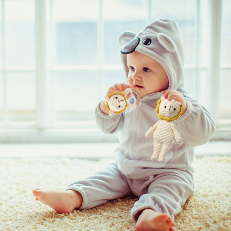 Multiple-angle display of handmade knitted animal wooden baby rattle – ideal for baby showers and newborn presents