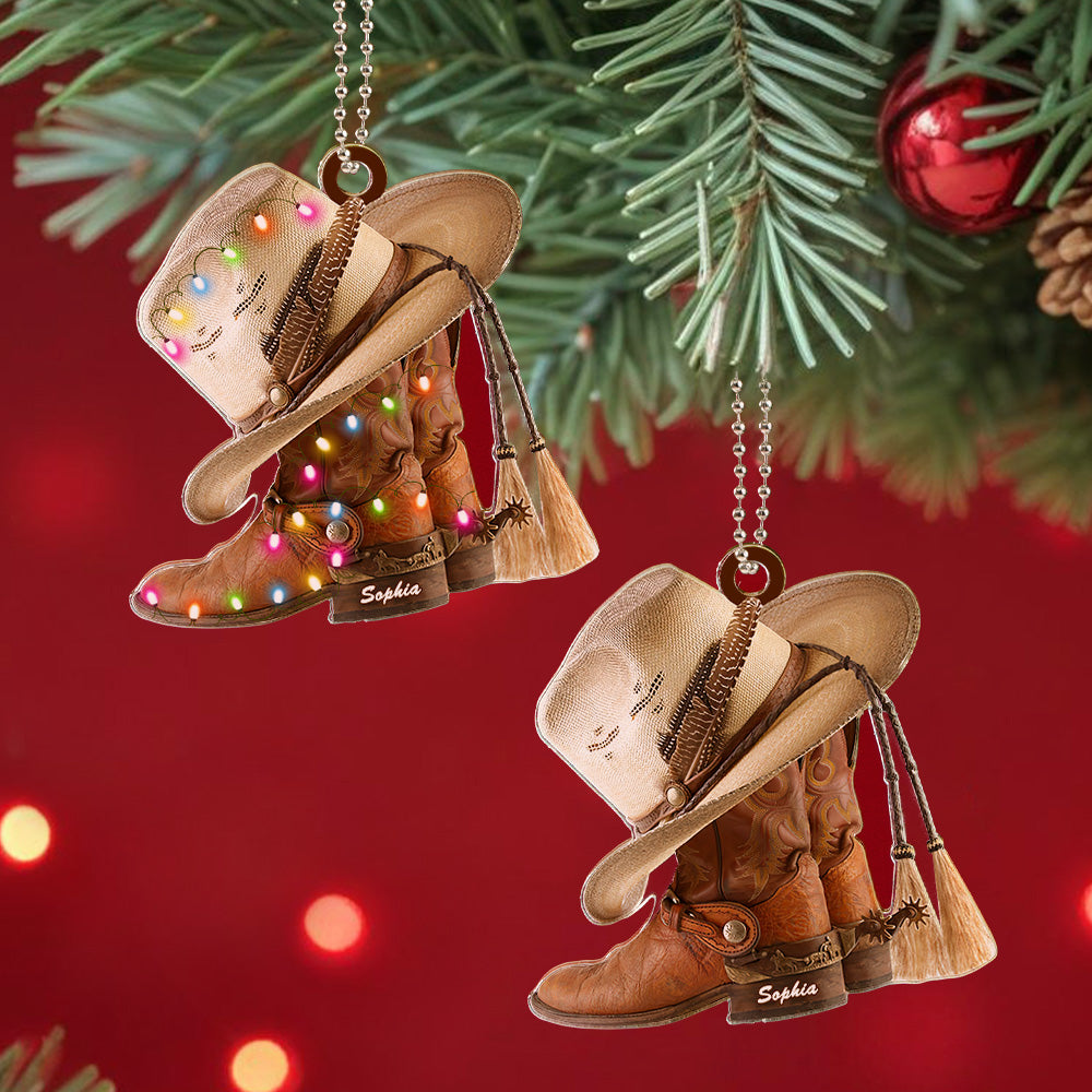 Detail of the boots and hat motif on the personalised acrylic western car ornament.