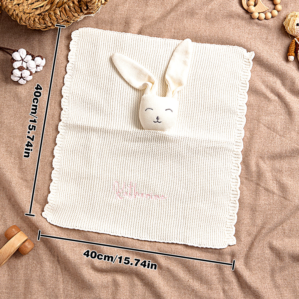 Lifestyle shot of the bunny towel in a nursery setting with cosy textures.