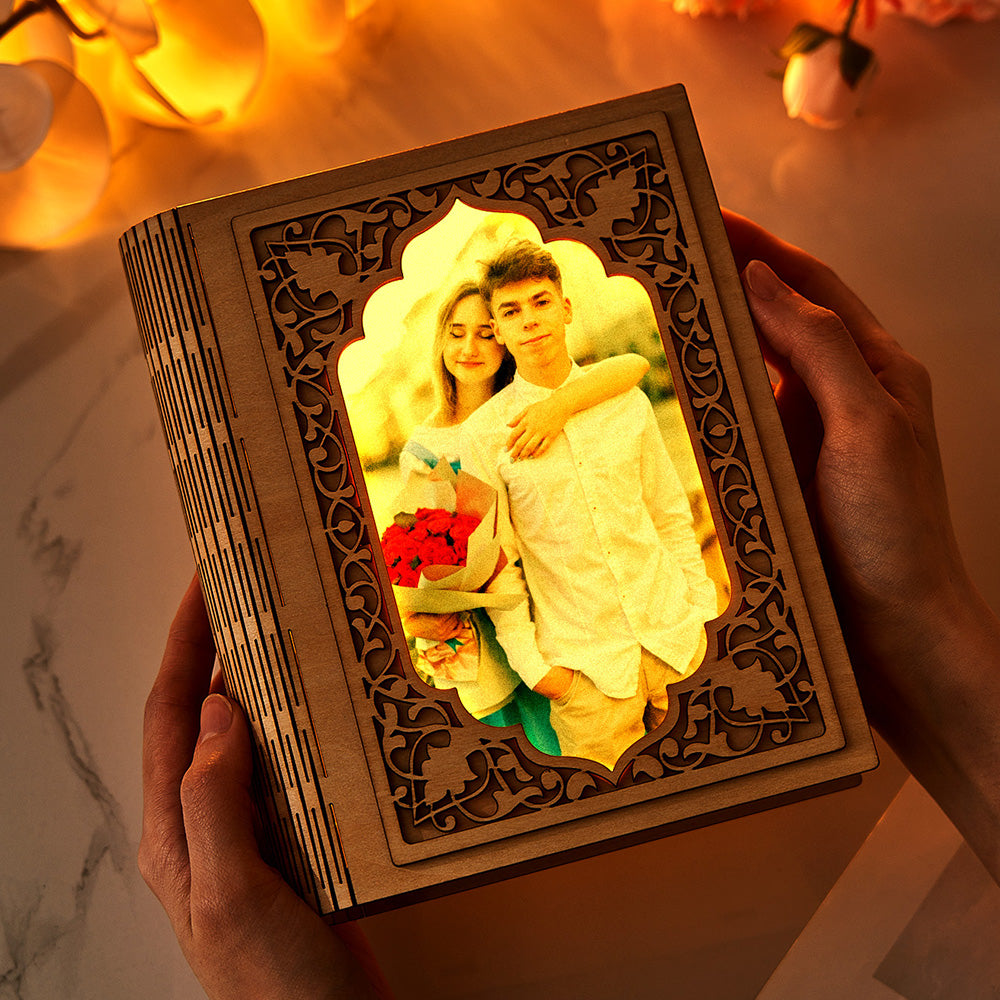 Close-up of personalised grimoire-shaped mirror photo frame (16.5cm x 20cm) showing crystal-clear acrylic reflection and photo