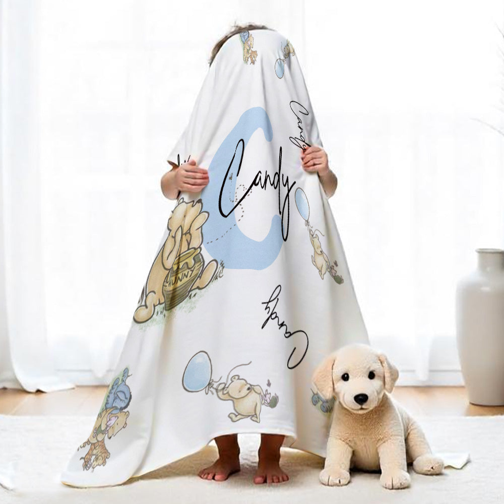 Flat lay of the Winnie the Pooh name blanket showing name print area.