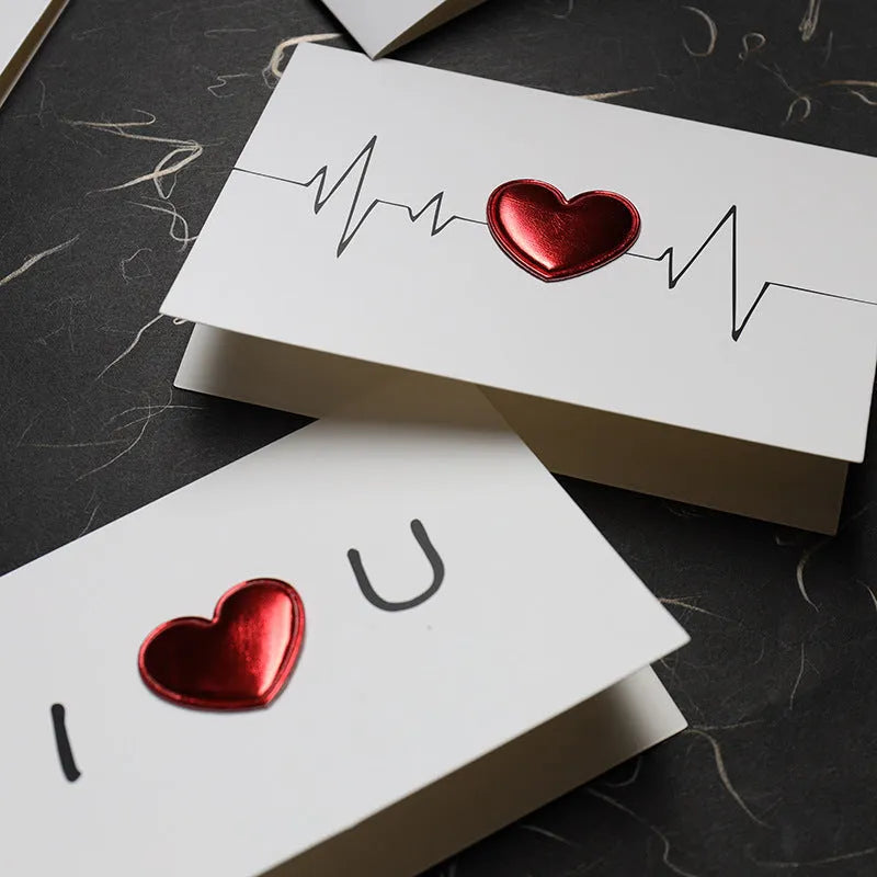 Close-up of three-dimensional heartbeat Love Greeting Card with red pop-up heart and ECG line, premium paper 10×15 cm ideal for valentine's day and anniversary gifting