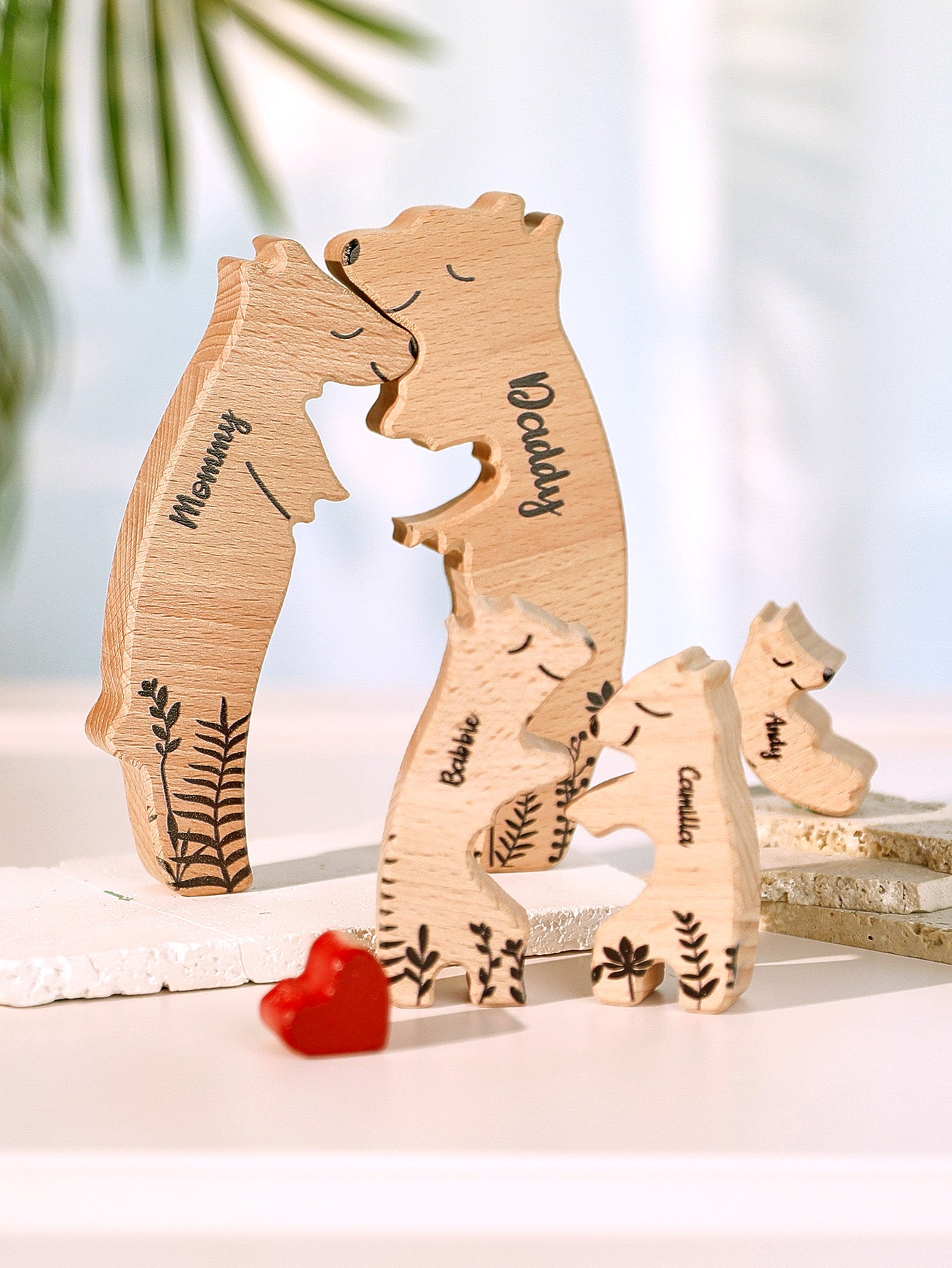 Personalised wooden heart bear puzzle displayed on a mantelpiece – engraved family names, ideal personalised home décor