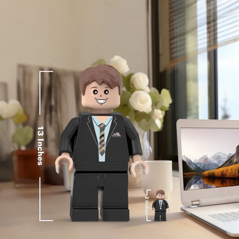 Scale comparison: personalised giant minifig beside a standard minifigure to demonstrate size
