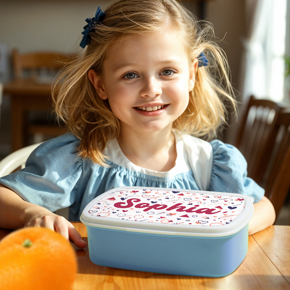 Child holding personalised cute lunch box with name at school — back-to-school and birthday gift idea for boys and girls, encourages belonging and tidy lunches