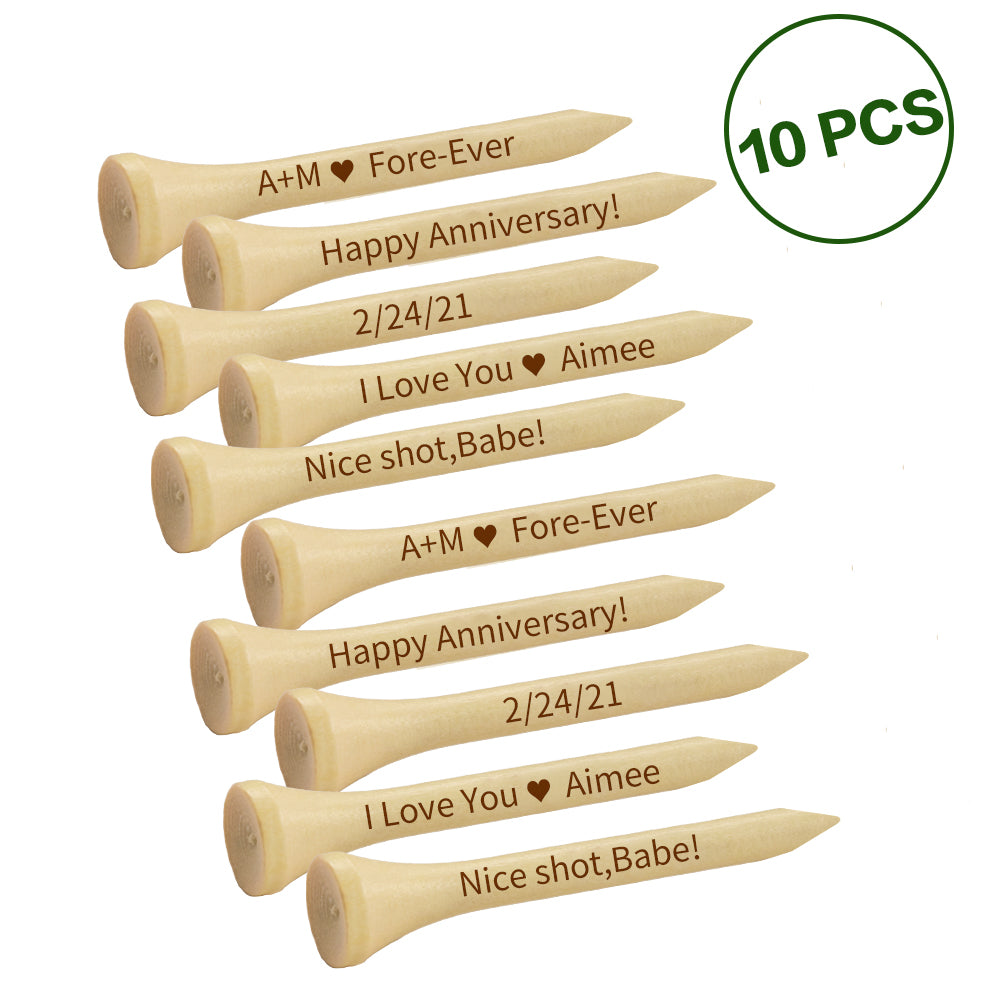 Single engraved wooden golf tee beside a golf ball on short grass demonstrating added tee height — personalised gift for dads and groomsmen