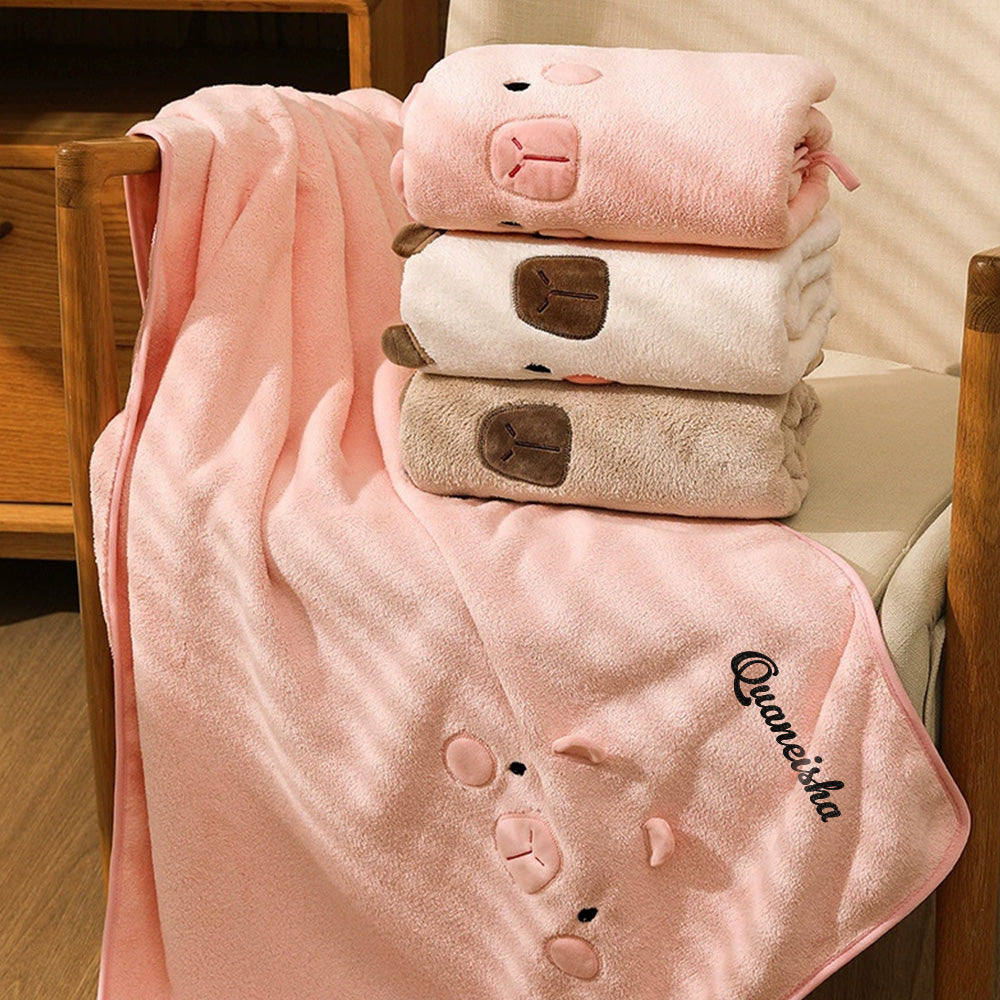 Gift-wrapped personalised bath towel with embroidered name, premium presentation for birthdays and anniversaries