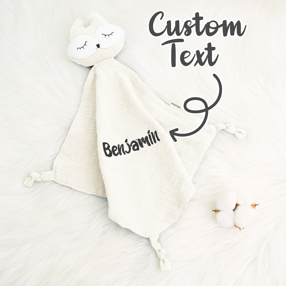 Personalised cotton comforter hanging in a nursery with embroidered name visible — a gender-neutral nursery essential made from soft premium cotton