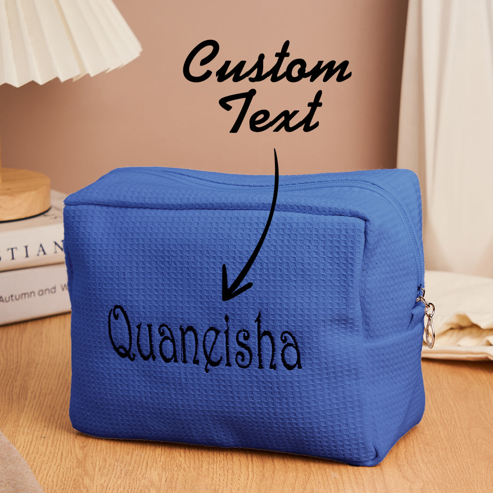 Open personalised waffle make-up bag displaying organised brushes and cosmetics, travel-friendly organiser
