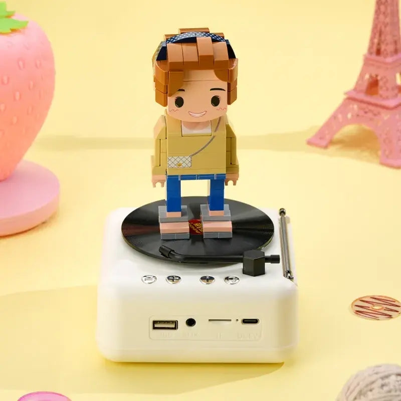 Side profile of custom brick figure on Bluetooth speaker base highlighting clothing detail and pose — customisable one-person brick figure speaker