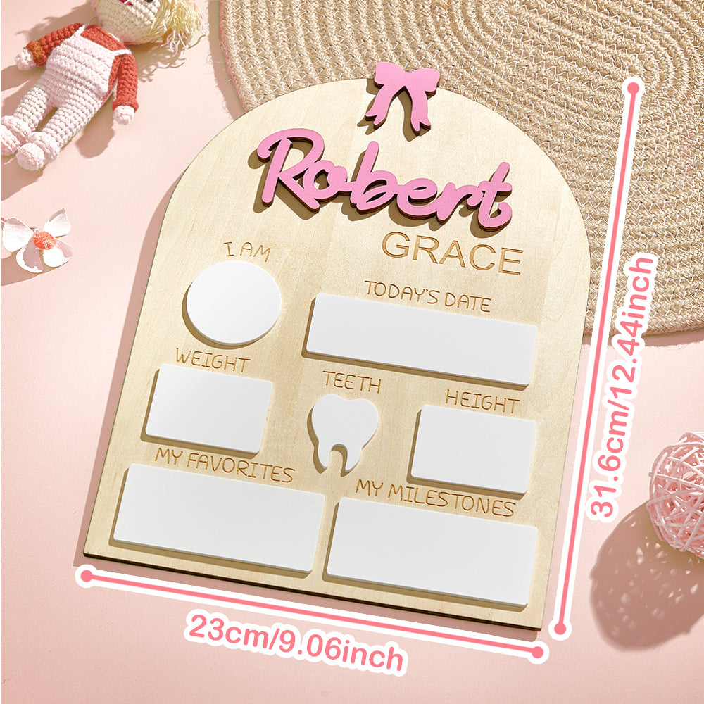 Assortment of personalised baby name signs in different styles and colours on studio display