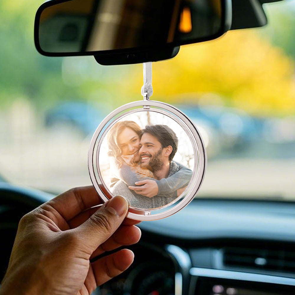 Close-up of rotating photo sides on the personalised car pendant, showing a high-resolution keepsake.