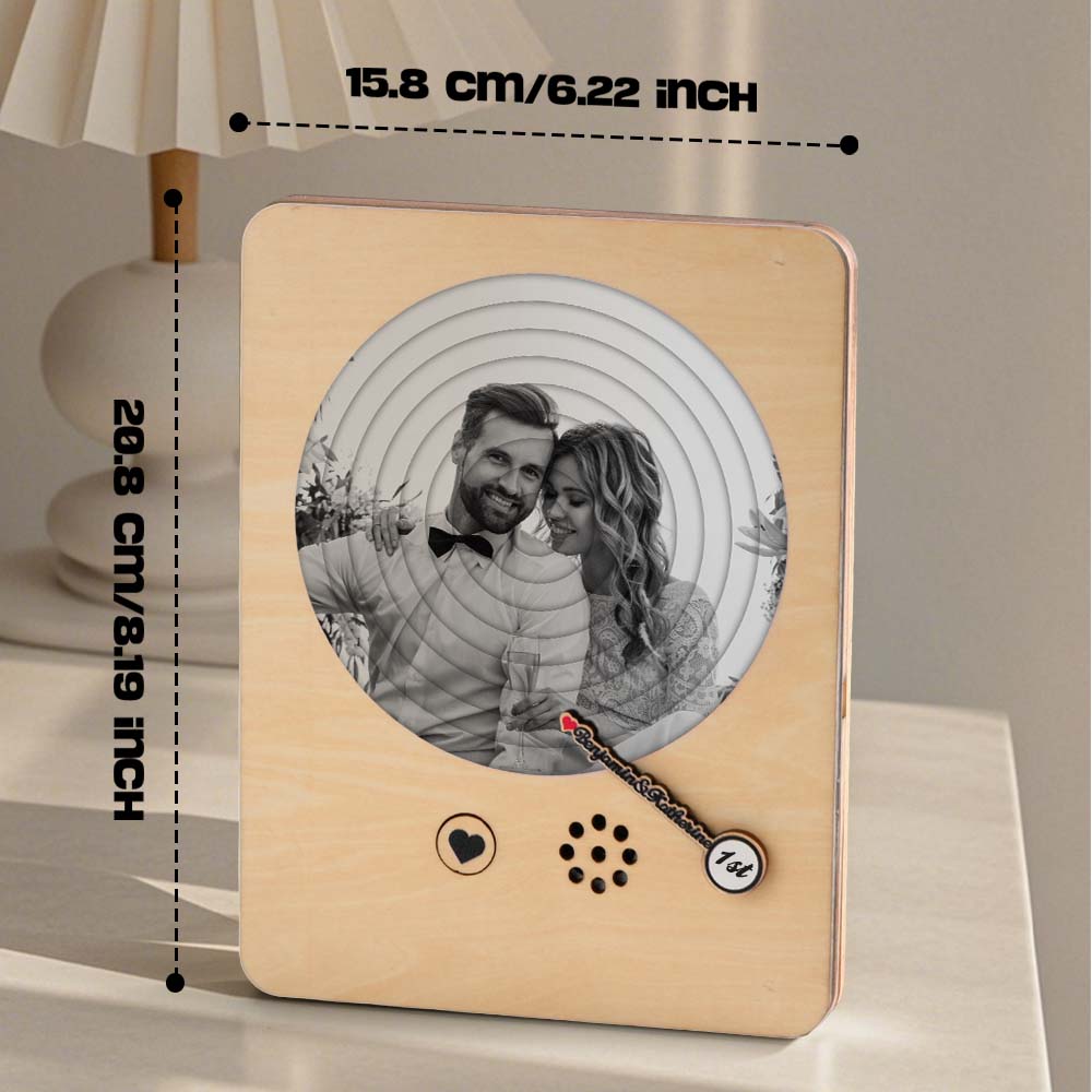 Couple unwrapping a personalised photo music box — sentimental engraved wooden music player gift for anniversaries