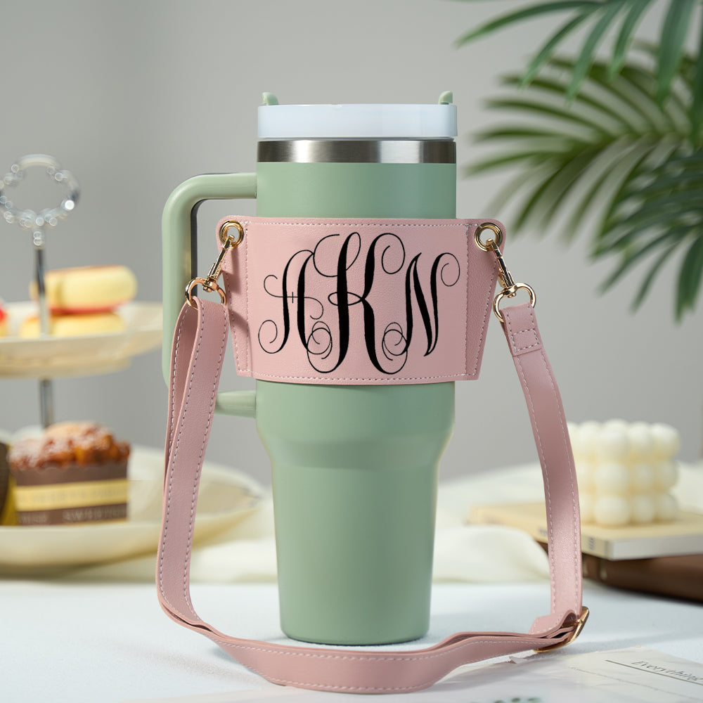 Close-up of personalised monogram detail on PU leather 40oz Stanley tumbler carrier showing neat stitching and scratch-resistant finish