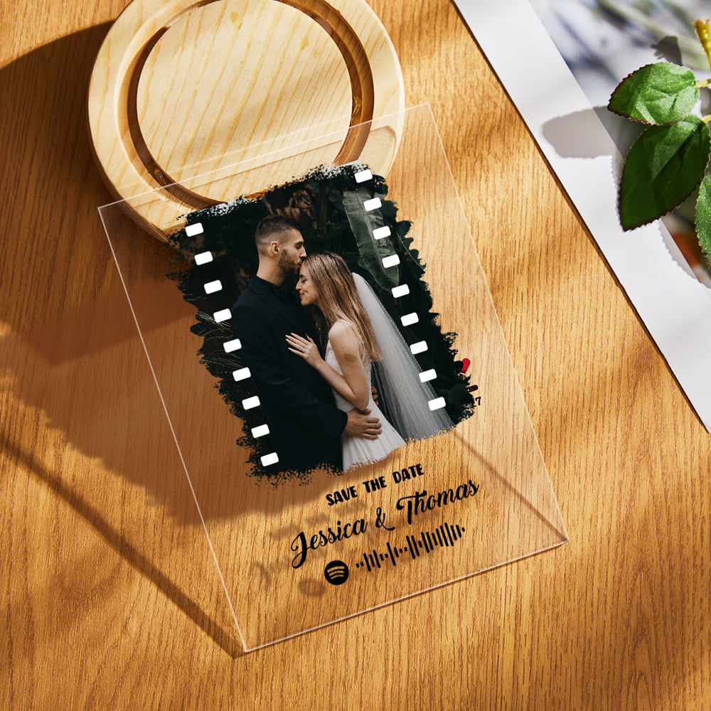 Close-up showing the engraved Spotify code next to the photo on the clear acrylic plaque.