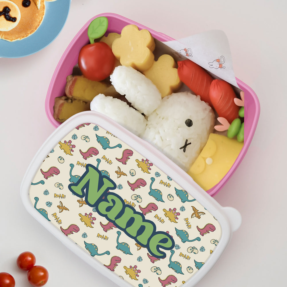 Close-up of personalised name on cute dinosaur lunch box – bespoke kids lunch box to reduce school mix-ups