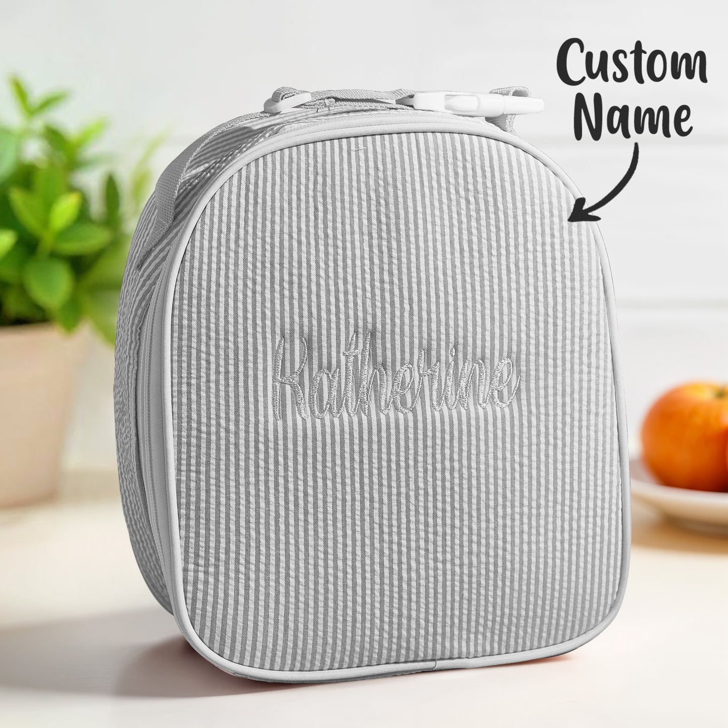 Detail of seersucker-style fabric texture on personalised lunch bag — lightweight, durable polyester that’s easy to wipe clean