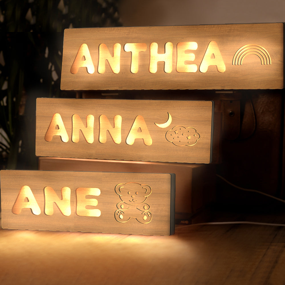 Personalised wooden night light with hand-cut pattern and engraved name on sturdy base — ideal baby shower gift