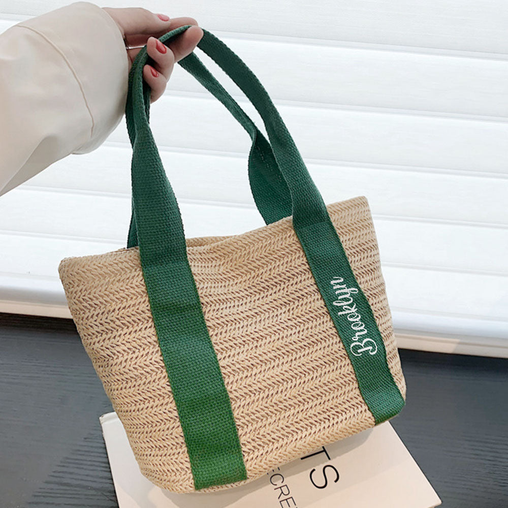 Bride-to-be carrying a personalised straw tote at the beach — custom bridal shower accessory and thoughtful wedding gift