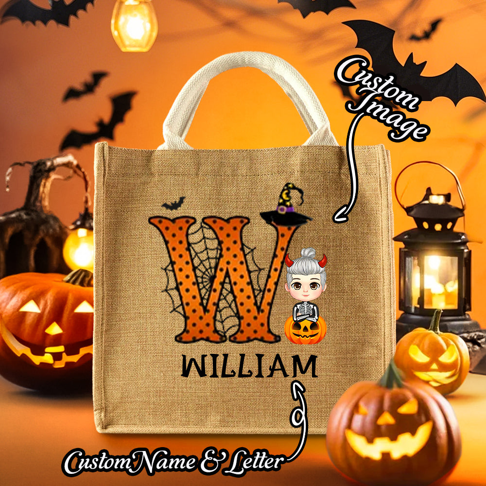 Personalised pumpkin tote displayed as a Halloween party favour for boys and girls – custom initial and name