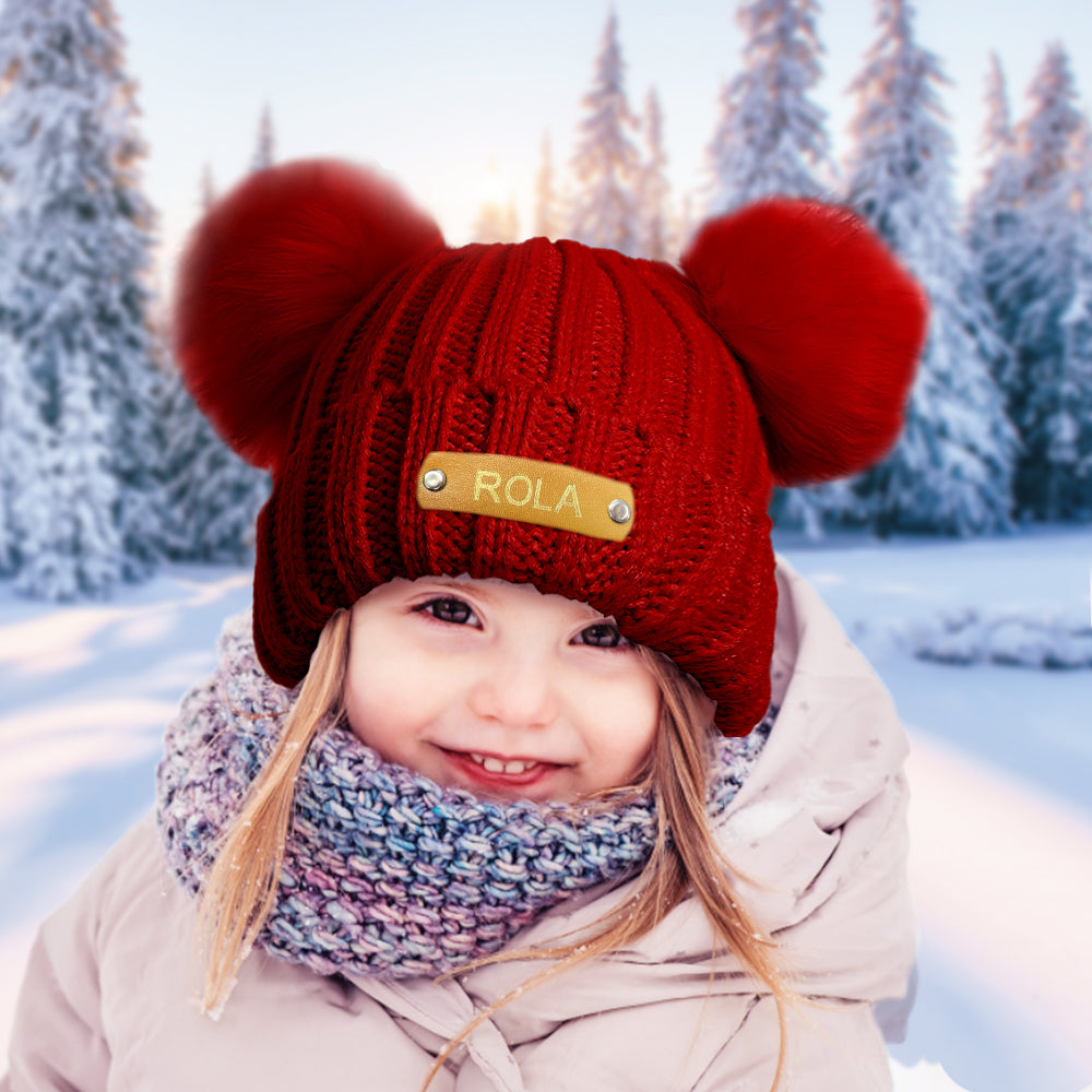 Selection of personalised baby beanies in five colours, each featuring a custom name leather patch – perfect baby shower present