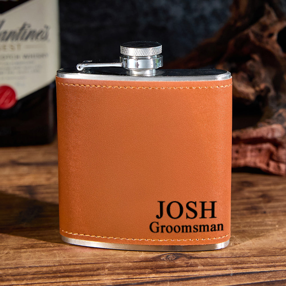 Detail shot of deep engraving on leather-wrapped personalised whiskey flask highlighting crisp text and textured PU leather finish