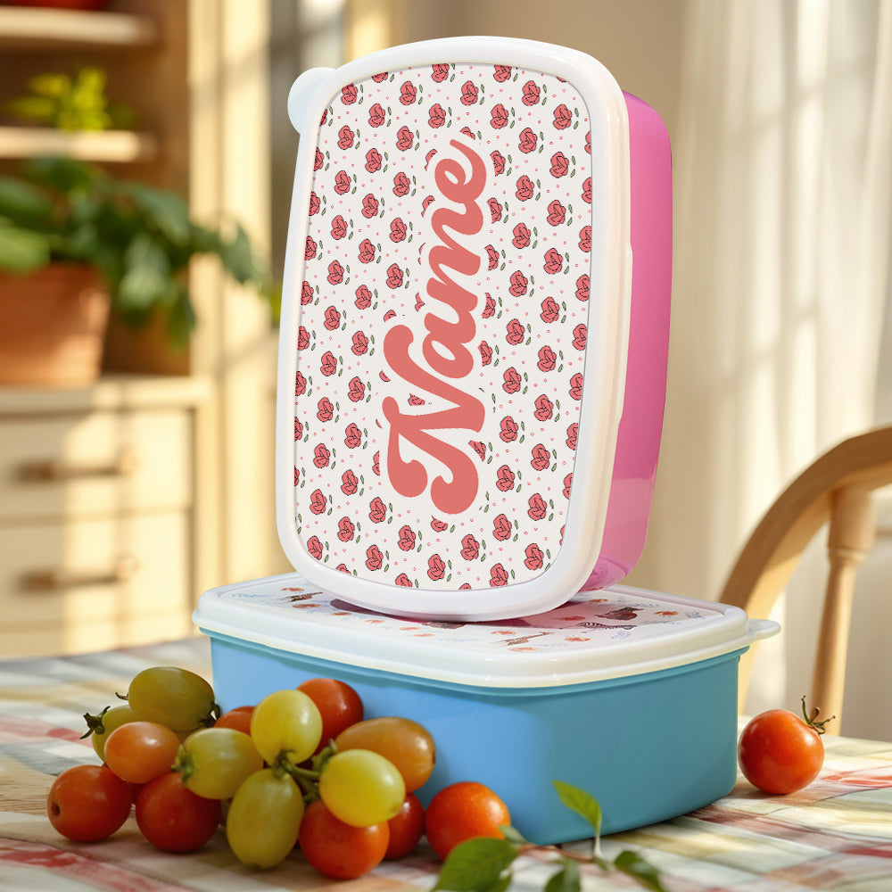 Child-friendly personalised name lunch box with playful flower design packed for school or picnic — great birthday gift for boys and girls
