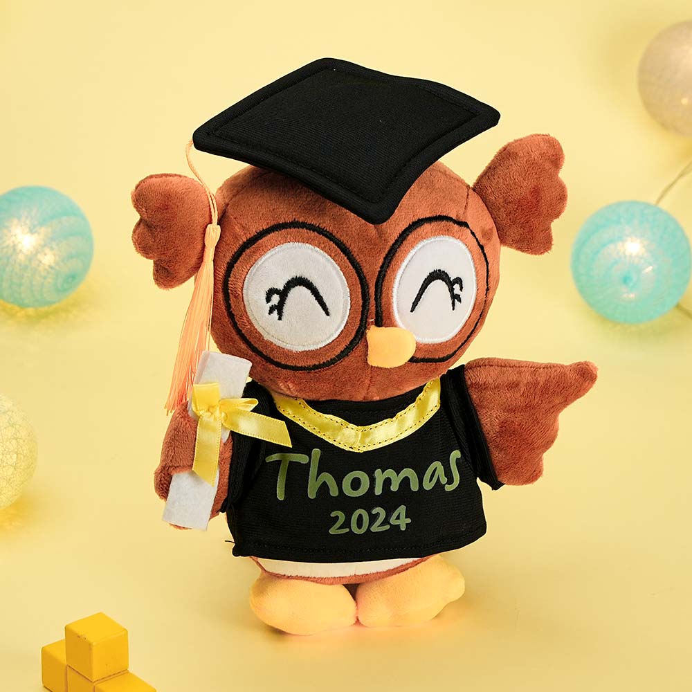 Close-up of printed custom name and graduation date on a soft owl plush – personalised graduation gift detail