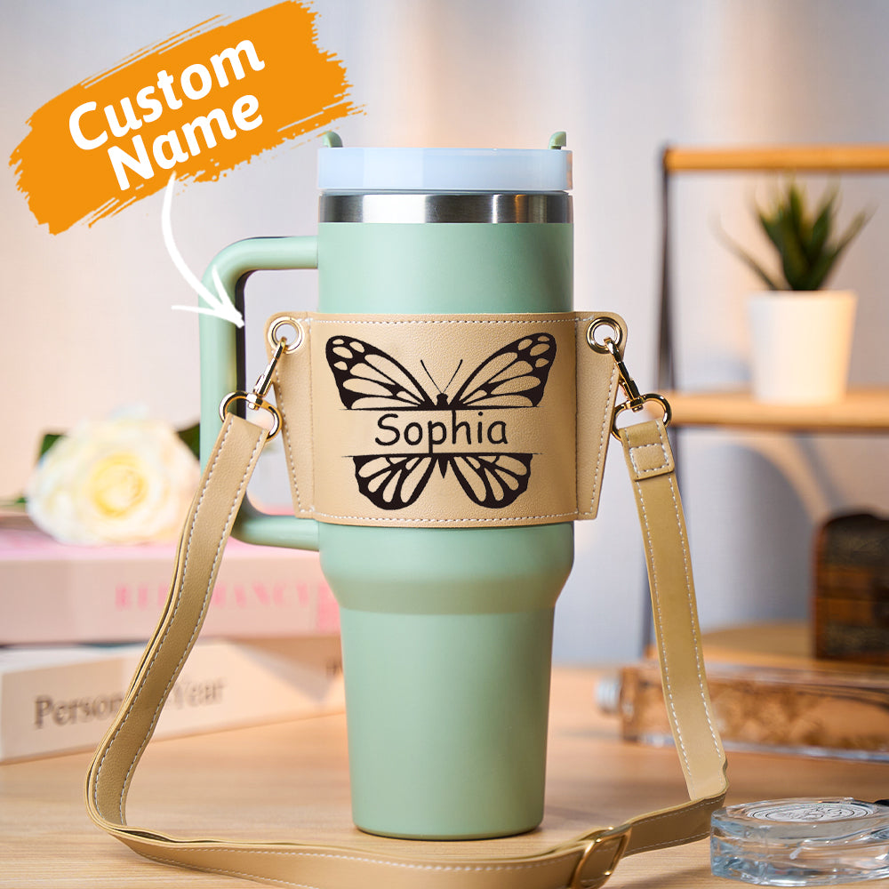 Personalised butterfly PU leather water bottle carrier bag holding a 40oz Stanley tumbler with adjustable cross‑body strap, hands‑free design