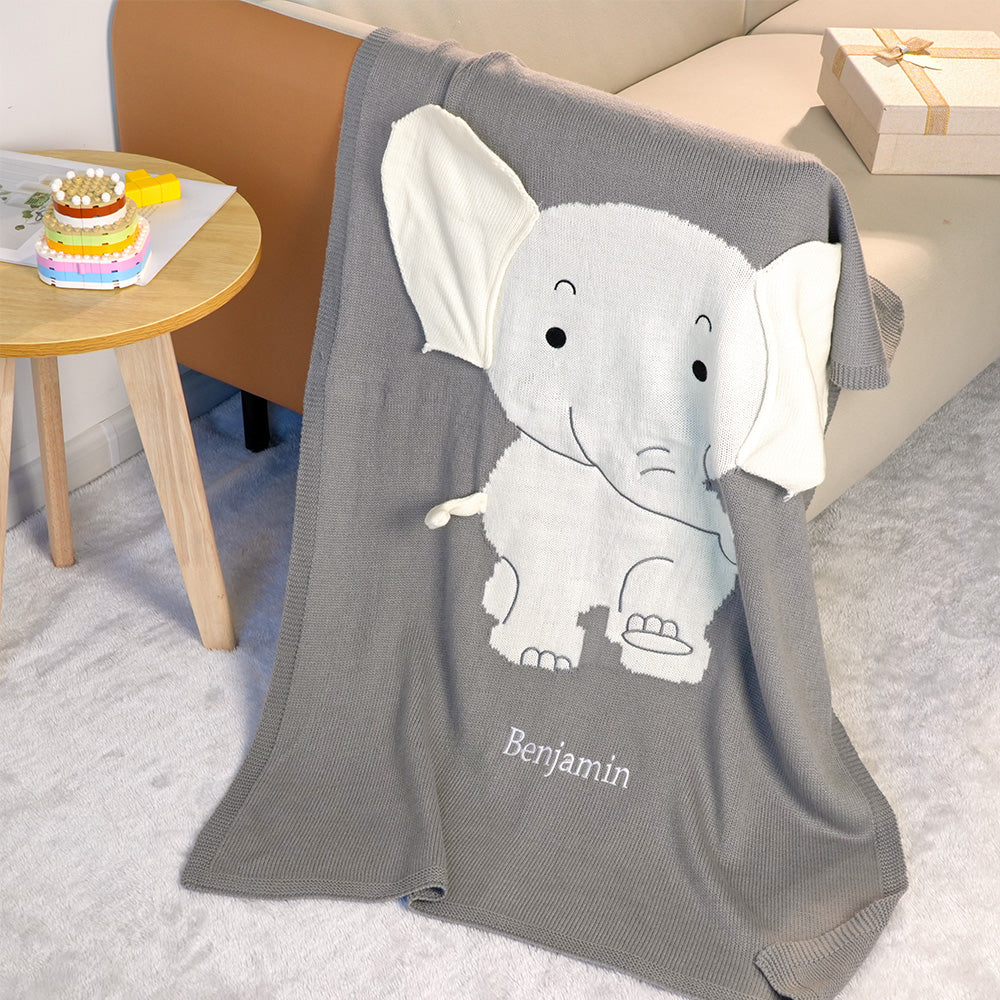 Soft polyester knitting fabric detail on a personalised grey elephant baby blanket.