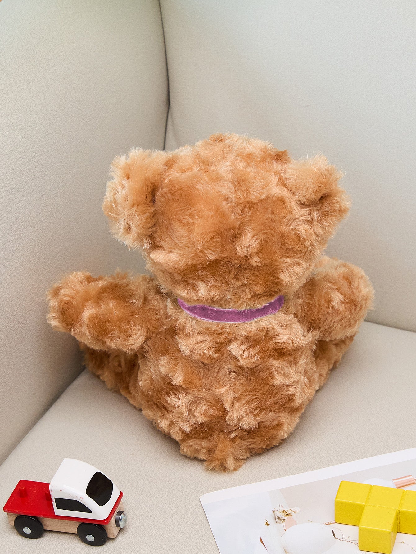 Macro shot of crisp embroidered lettering on a personalised bear displaying birth statistics and high-quality stitching