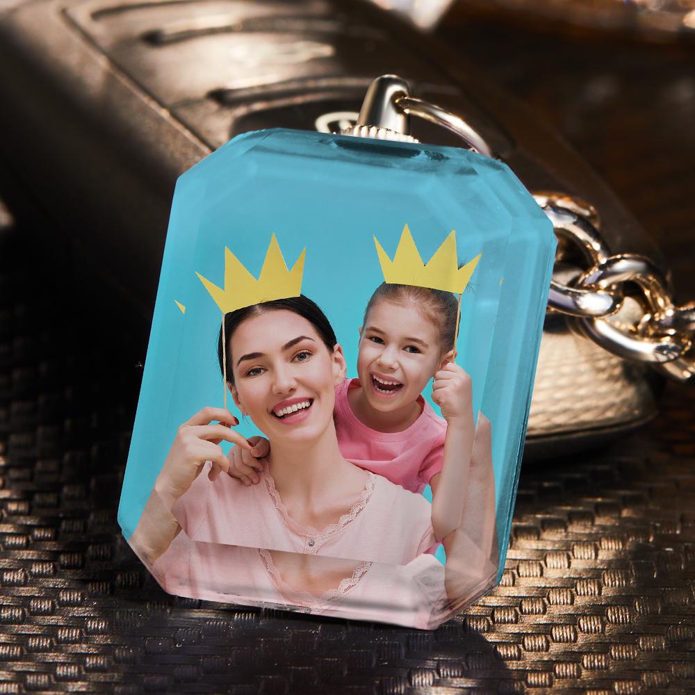 Angled view of custom double-sided crystal keyring showing vivid UV-printed images and three-dimensional light transmission