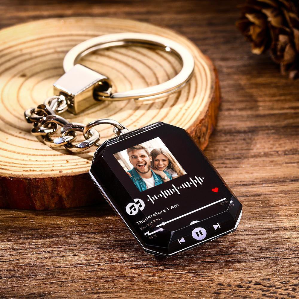Close-up of personalised crystal music keyring with engraved photo and scannable sound code