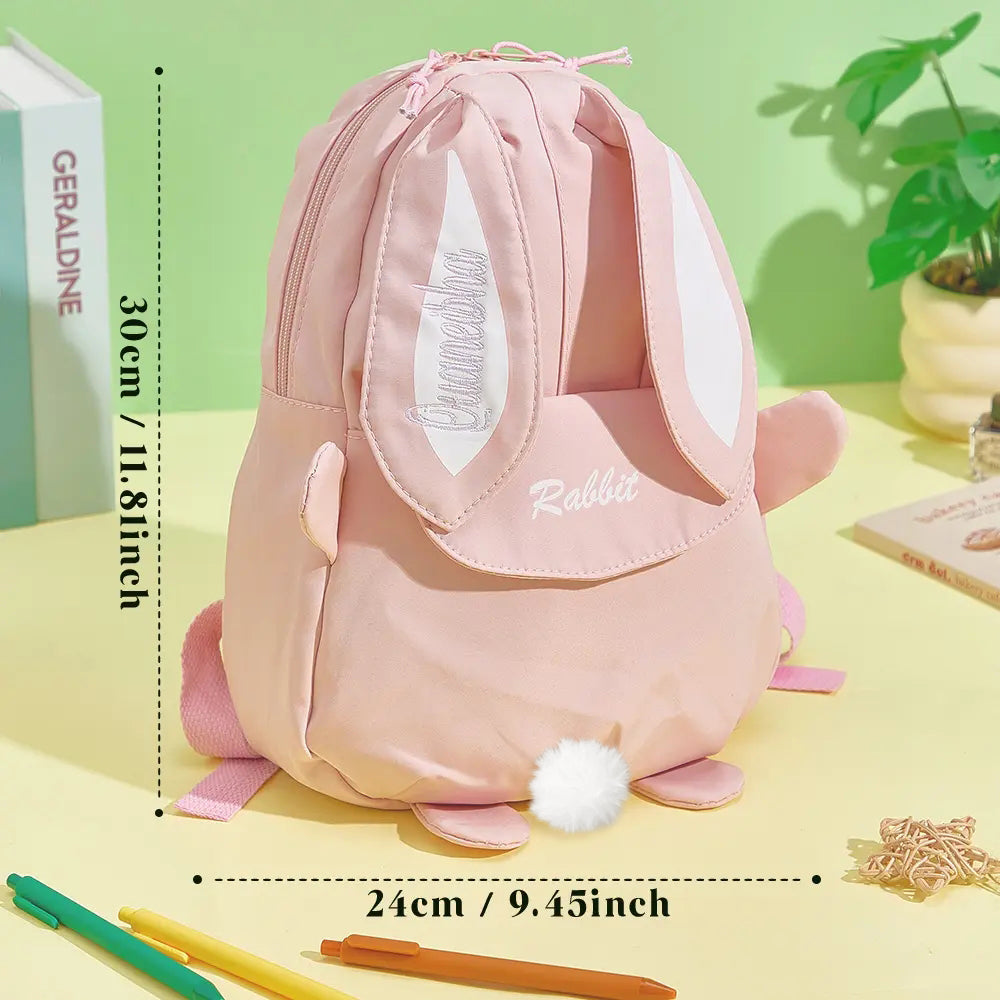 Collection view of personalised mini rabbit backpacks showing custom name embroidery options and colourways, perfect for toddlers and young children