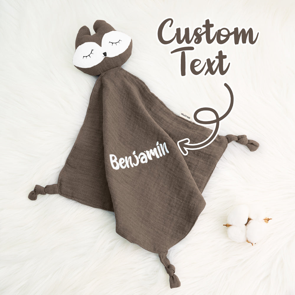 Mother tucking a personalised embroidered comfort towel around her baby — soft cotton soother for sleep, cuddles and reassurance