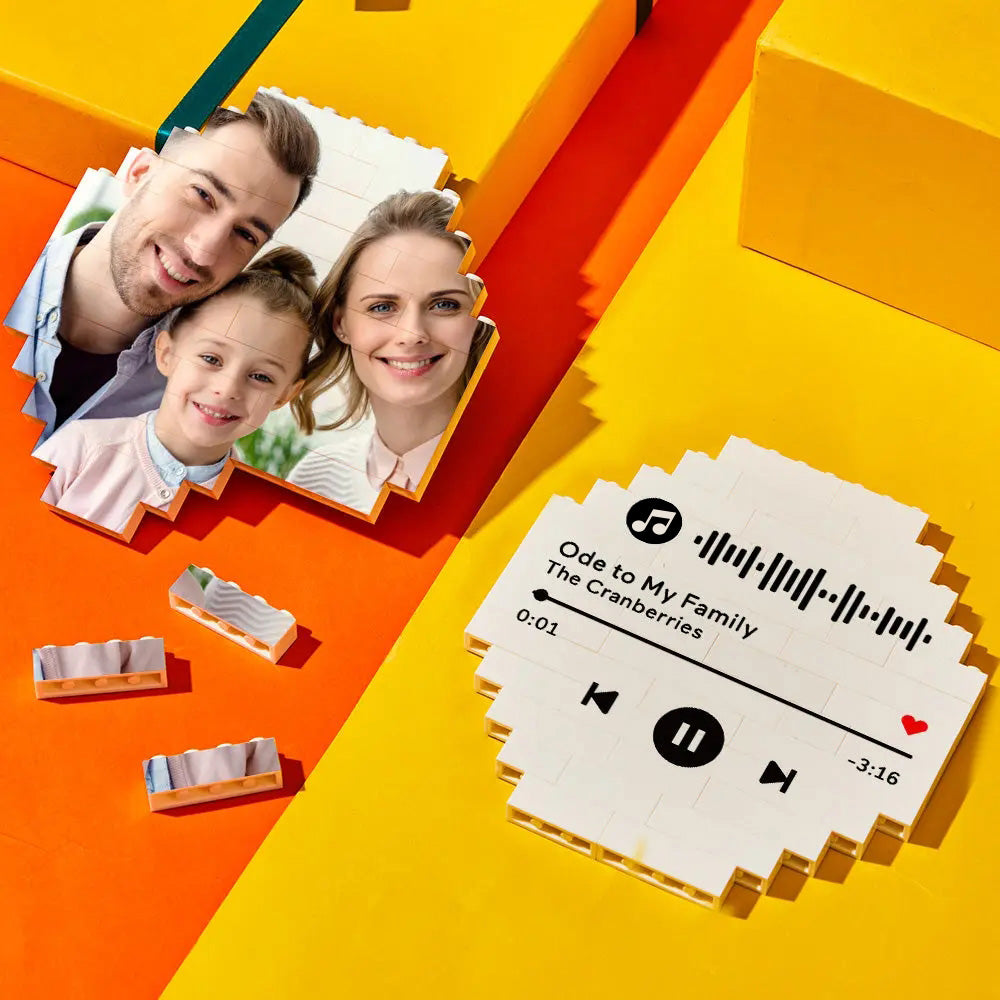 Family gathered around a table playing with custom photo building blocks – personalised octagon bricks creating shared memories and developmental play
