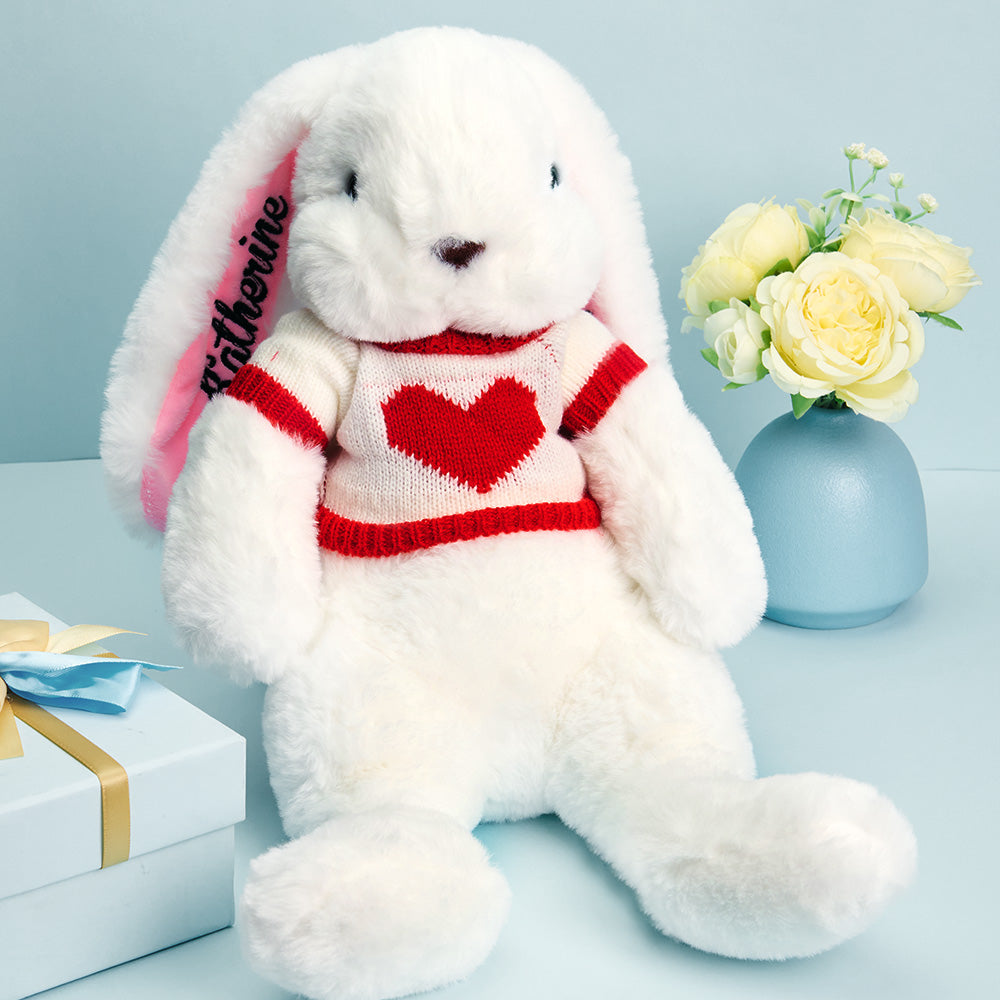 Close-up detail of embroidered name on personalised rabbit jumper, custom name rabbit plush keepsake