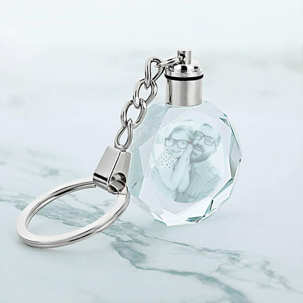Backlit personalised crystal keyring revealing colourful gradient glow when twisted — eye-catching engraved keepsake gift