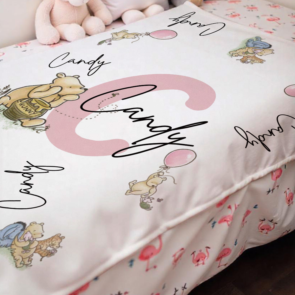 Winnie the Pooh print on a soft flannel blanket laid out for display.