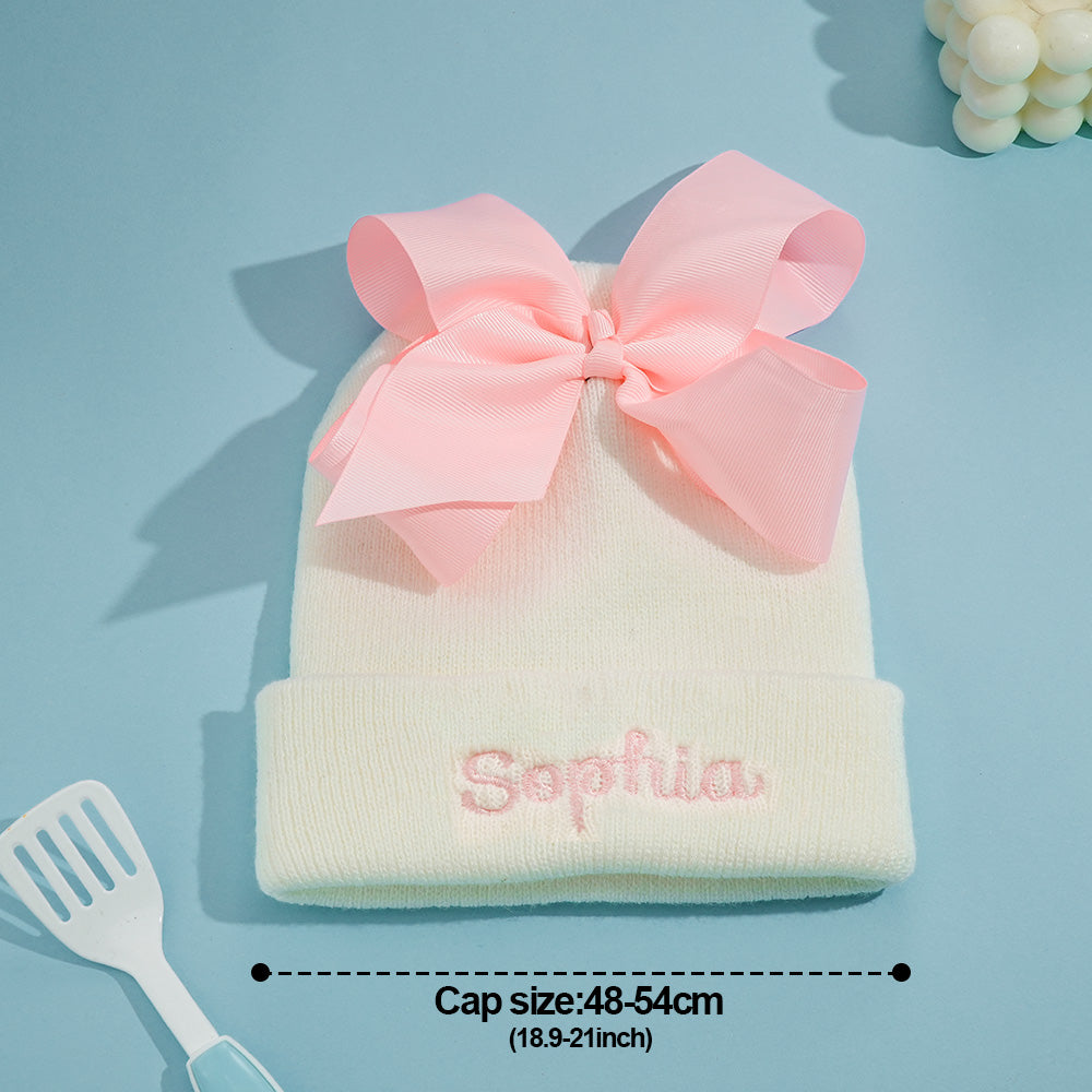 Family photoshoot moment with baby in personalised knitted bow beanie — timeless personalised keepsake