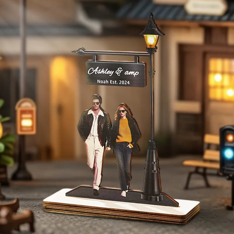 Illuminated wooden photo light display casting a warm glow, ideal for romantic settings and memories.