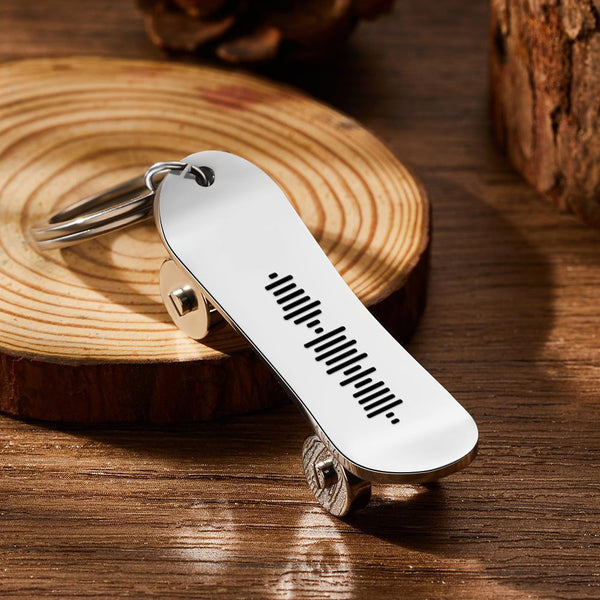 Personalised scannable music code skateboard keyring — polished stainless steel close-up showing laser-engraved music code and custom text, ideal custom skateboard keychain gift for music lovers