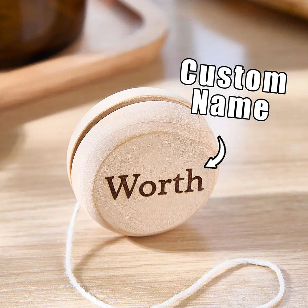 Selection of personalised wooden yo-yos displayed as party favours and stocking fillers — perfect gifts for sons and daughters