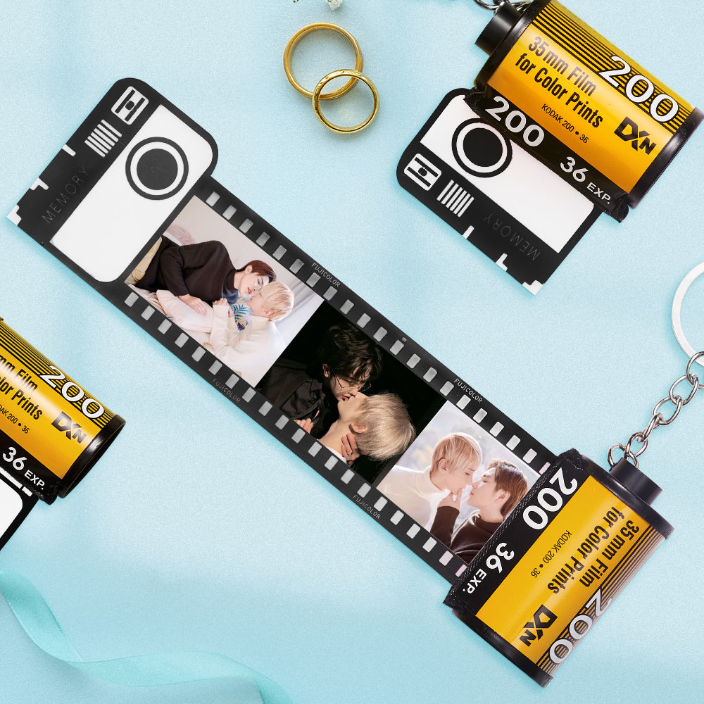 Close view of several photos inserted in the film-roll keychain, showing clear print.