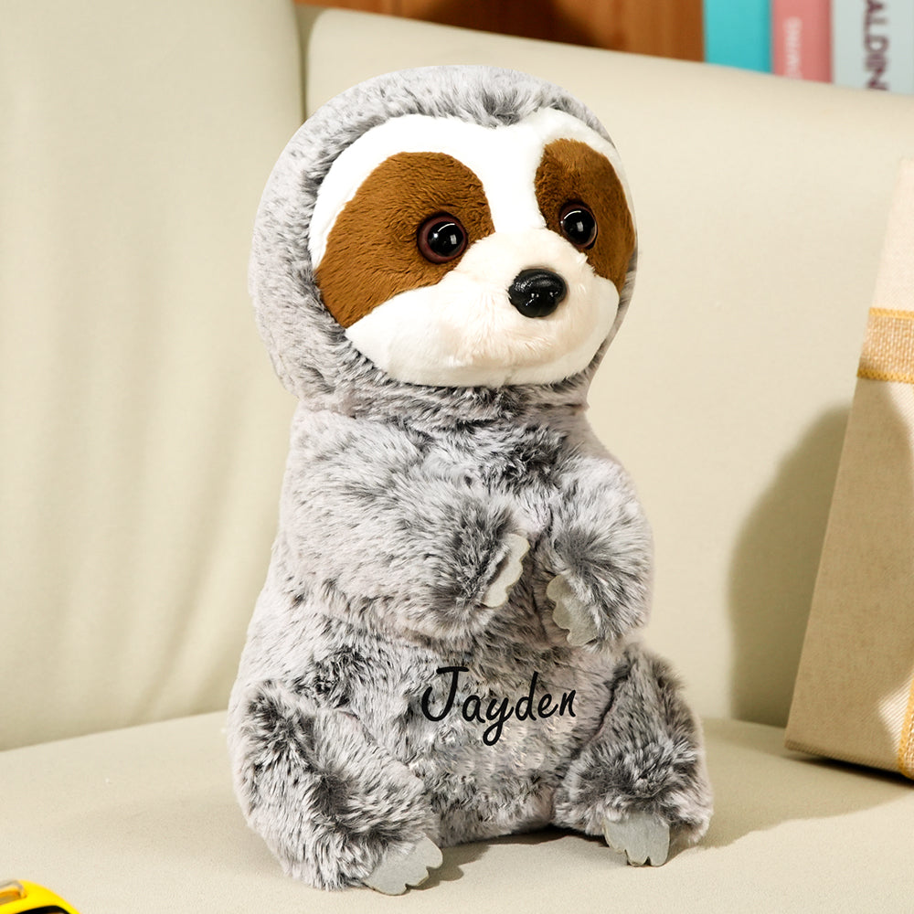 Close up of personalised text embroidery on sloth plush highlighting neat stitching and customisation for baby shower gift