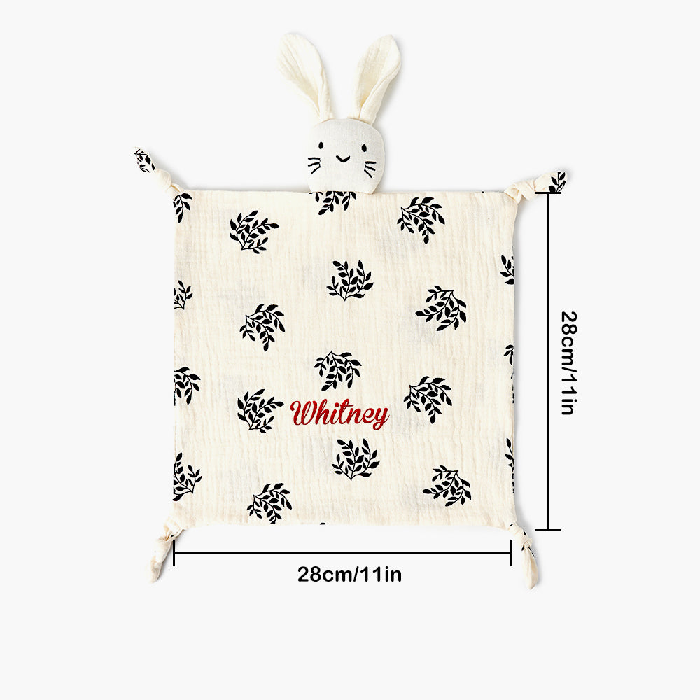 Flat lay view of personalised baby comforter showing 30cm square size
