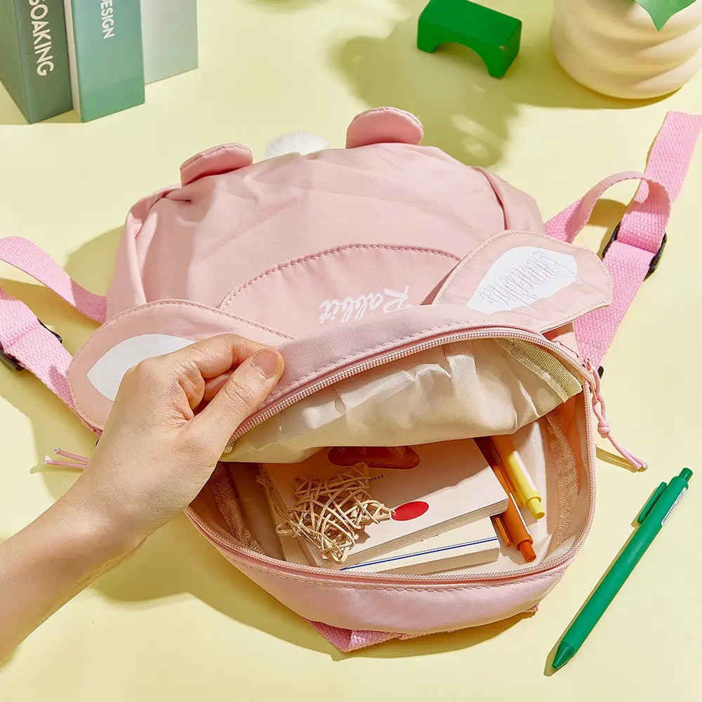 Toddler wearing personalised name embroidery mini rabbit backpack on a day out, compact custom rucksack ideal for preschool, travel and everyday use