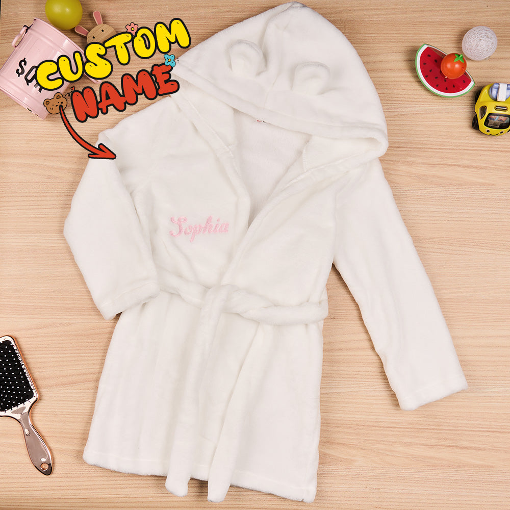 Folded personalised baby dressing gown with embroidered name ready as a thoughtful newborn keepsake or baby shower present